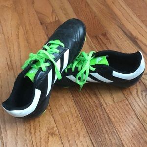 Adidas black soccer cleats with lime green